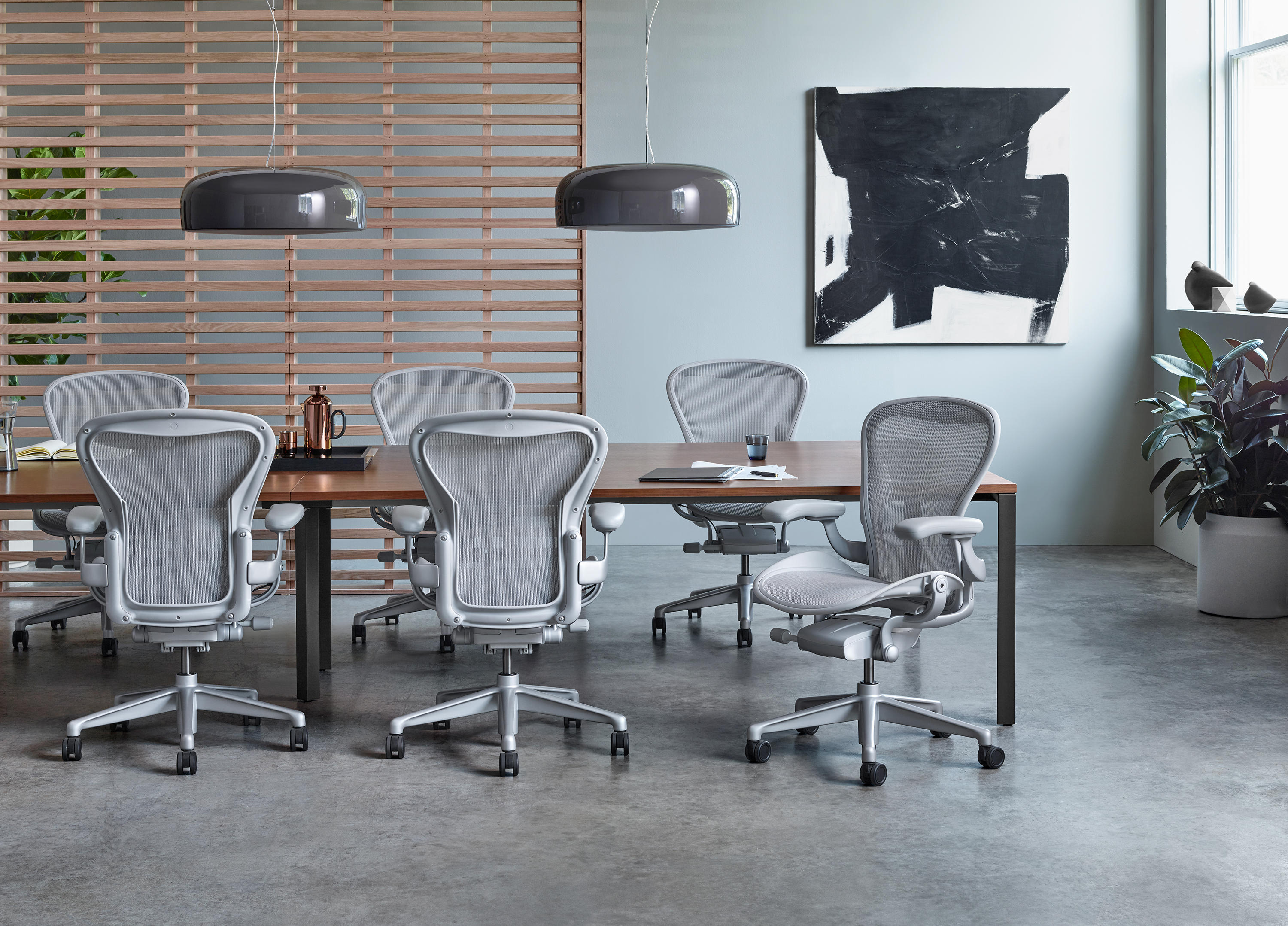 Lineage of architect-designed task chairs from Ergon (1976) and Meda Chair (1996) through Aeron (1994) to Foster + Partners' Muku for Okamura (June 2026)
