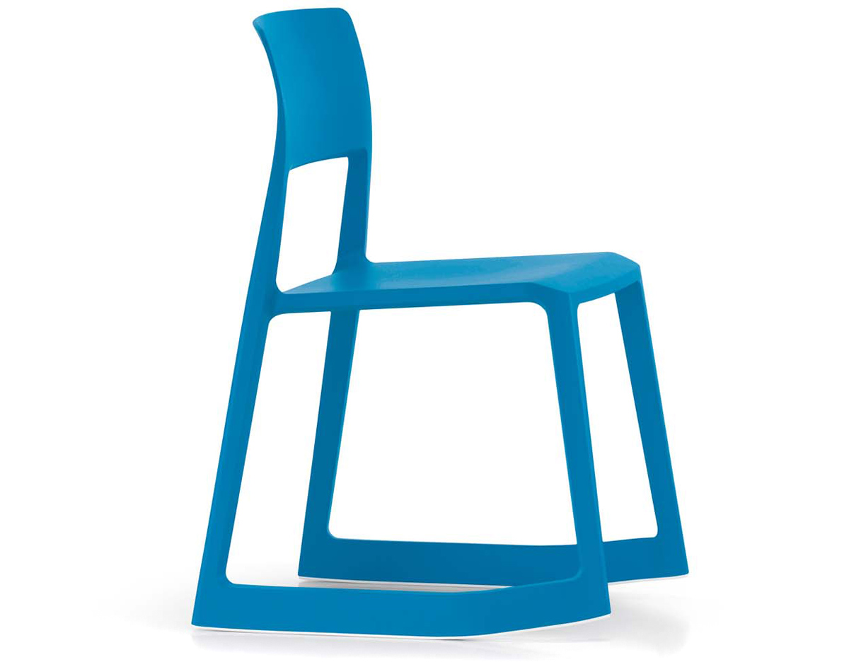 Edward Barber and Jay Osgerby's Tip Ton chair for Vitra alongside the Tab Light for Flos, on a plywood Loop Table for Isokon Plus.