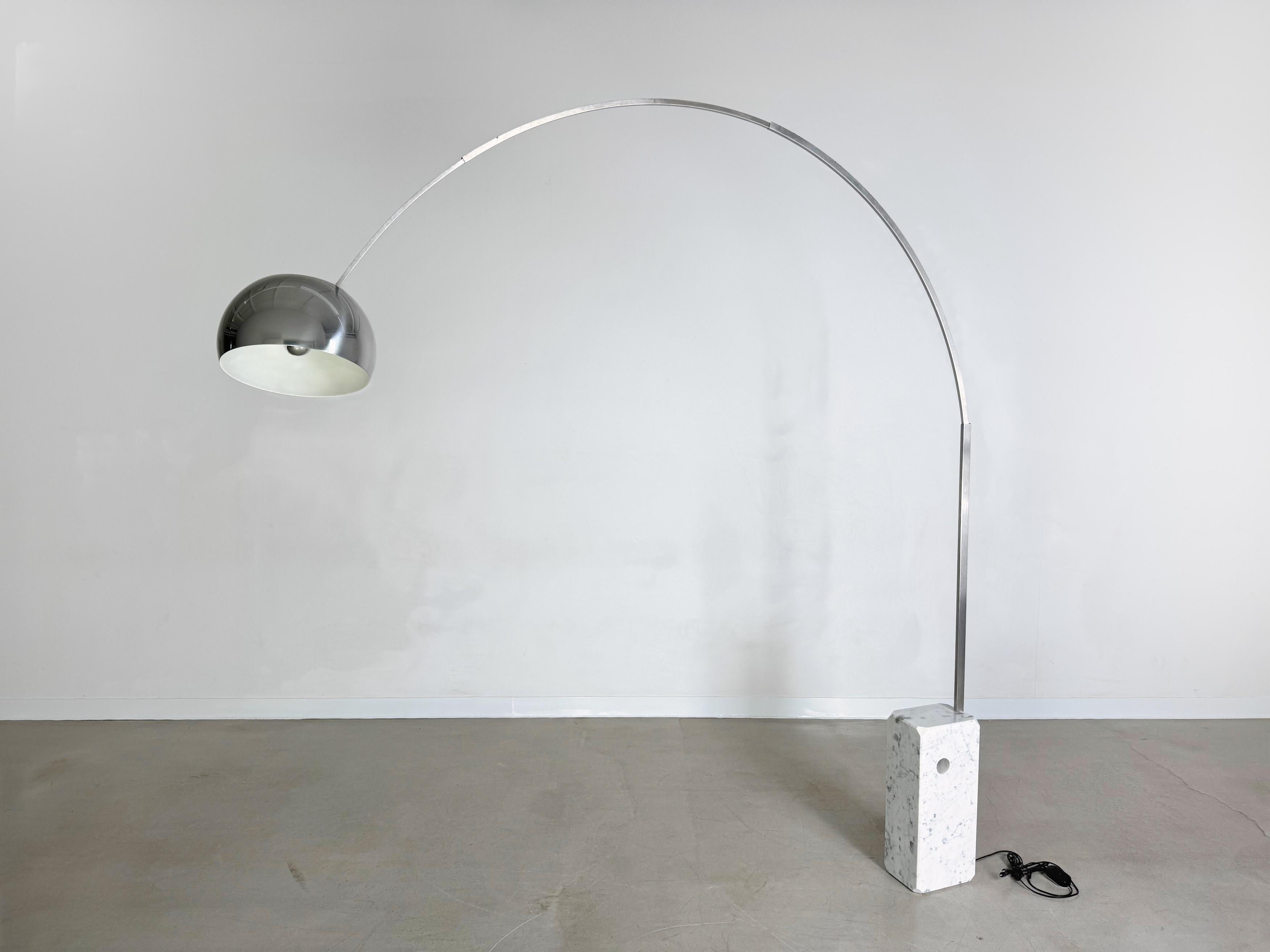 Achille Castiglioni's Arco floor lamp with Carrara marble base and stainless steel arc, produced by Flos since 1962